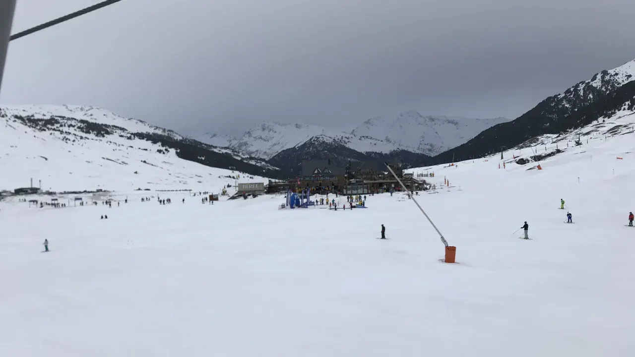 A ski instructor teaching a group of beginners on the Beret nursery slope