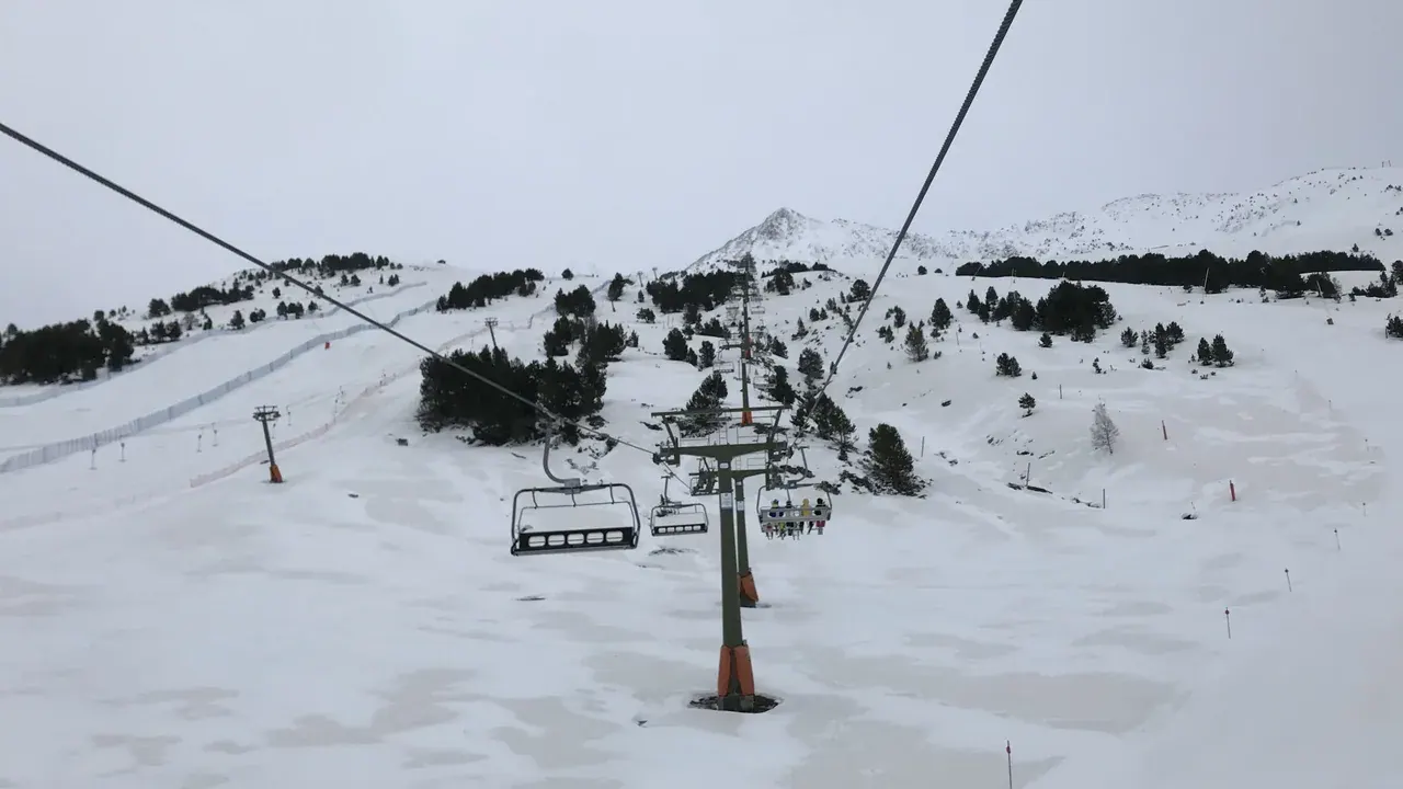 Chairlifts running above the pistes at Baqueira Beret