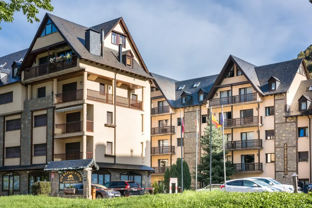 The stone-and-timber facade of the Aparthotel Eth Refugi d'Aran in Vielha