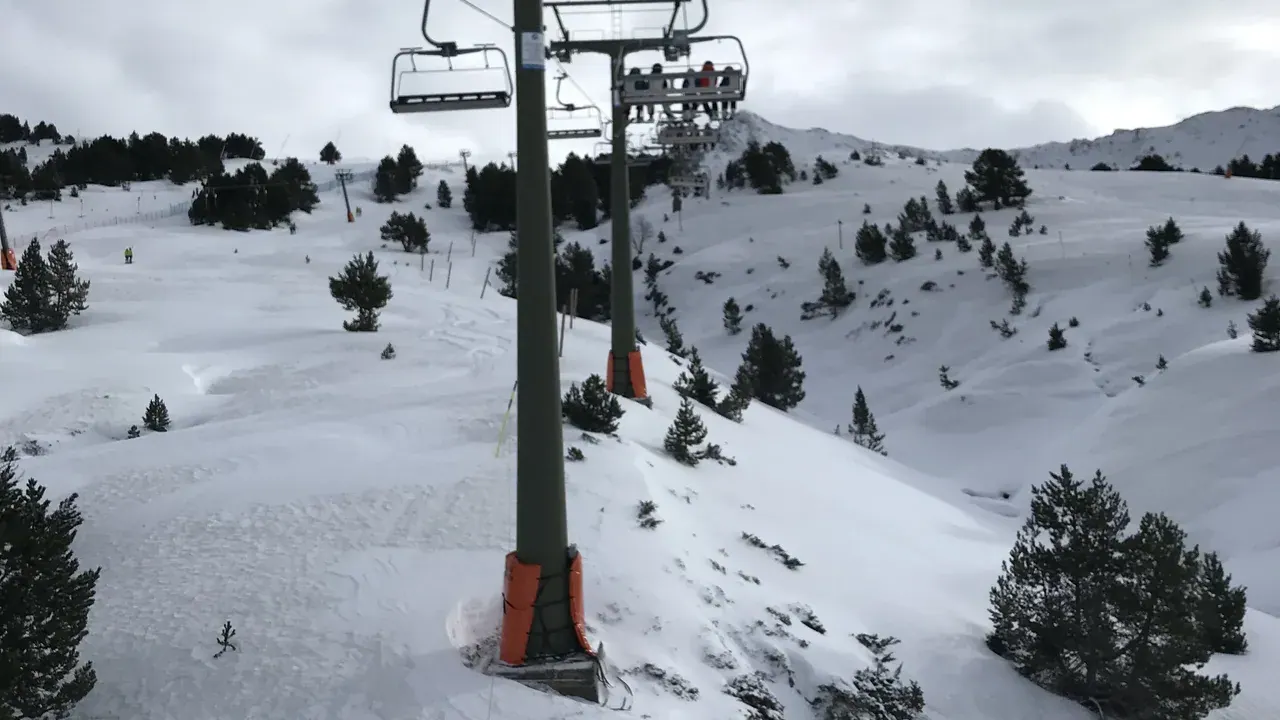 Pistes and chairlifts across the Baqueira Beret ski area beneath the Pyrenees peaks